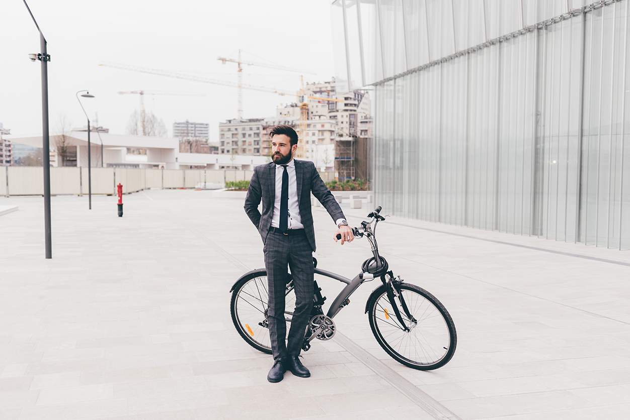 contemporary businessman riding bike 2023 11 27 05 02 50 utc